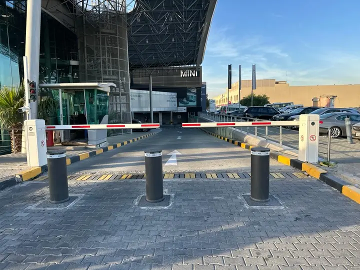 Bollards and barrier at a vehicle entrance